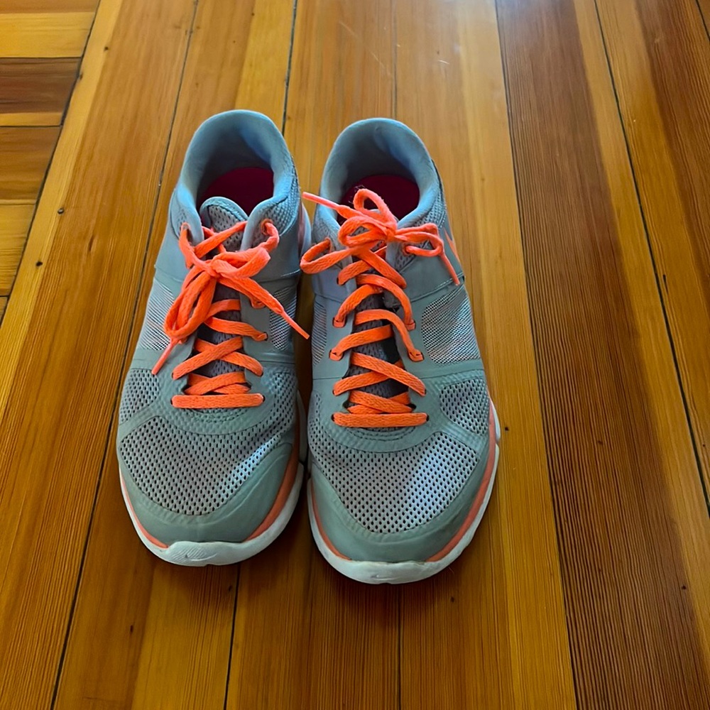 Gently worn Nike flex running sneakers with neon orange details